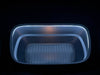 Rectangular container with a textured bottom on a black background in a 2026 Tesla Model Y Juniper Frunk LED Light