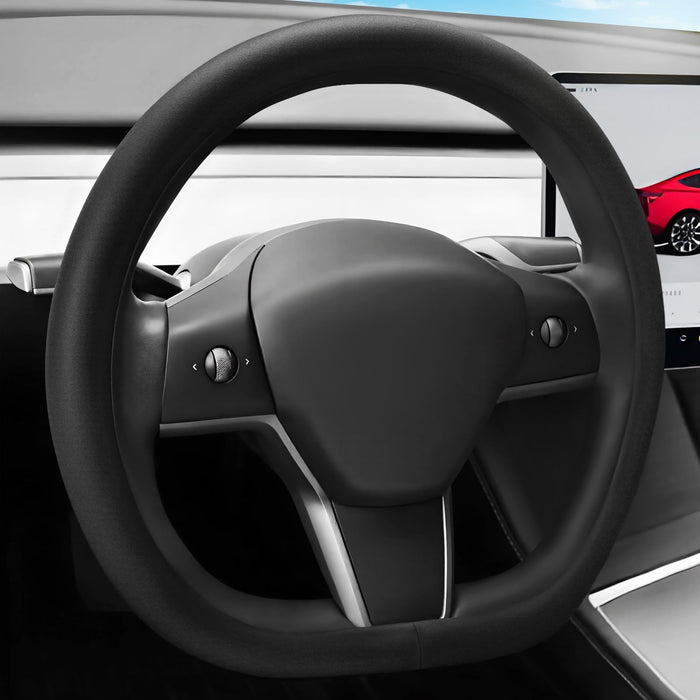 Steering wheel of a car with a dashboard in the background