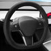Steering wheel of a car with a dashboard in the background