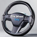 Carbon fiber steering wheel with 'This Wheel Only' text on a gray background