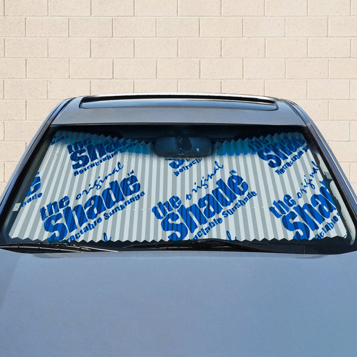 Manual retractable windshield sunshade logo option in vehicle