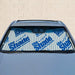 Manual retractable windshield sunshade logo option in vehicle