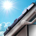 Manual retractable windshield sunshade retracted into housing