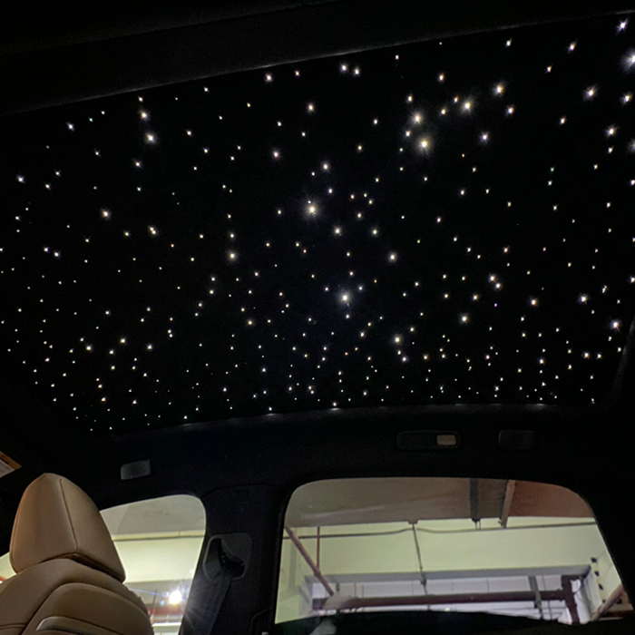 Black starry sky sunroof shade with illuminated star points