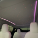 Gray starry sky sunroof shade installed with pink ambient lighting