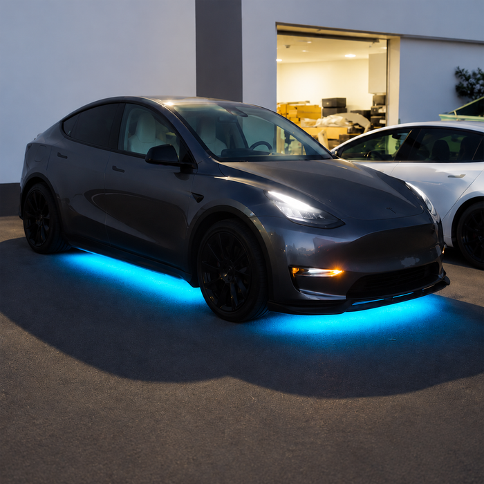 Illustrative Model Y installation with cyan-blue underbody lighting; comparable setup, not exact kit